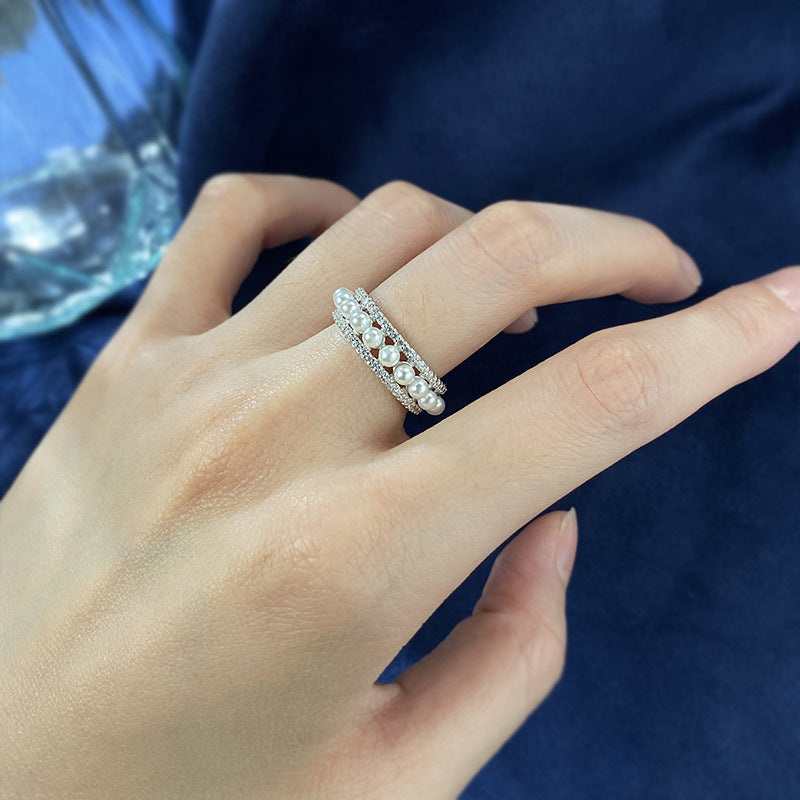 Bague en argent avec perle simple autour